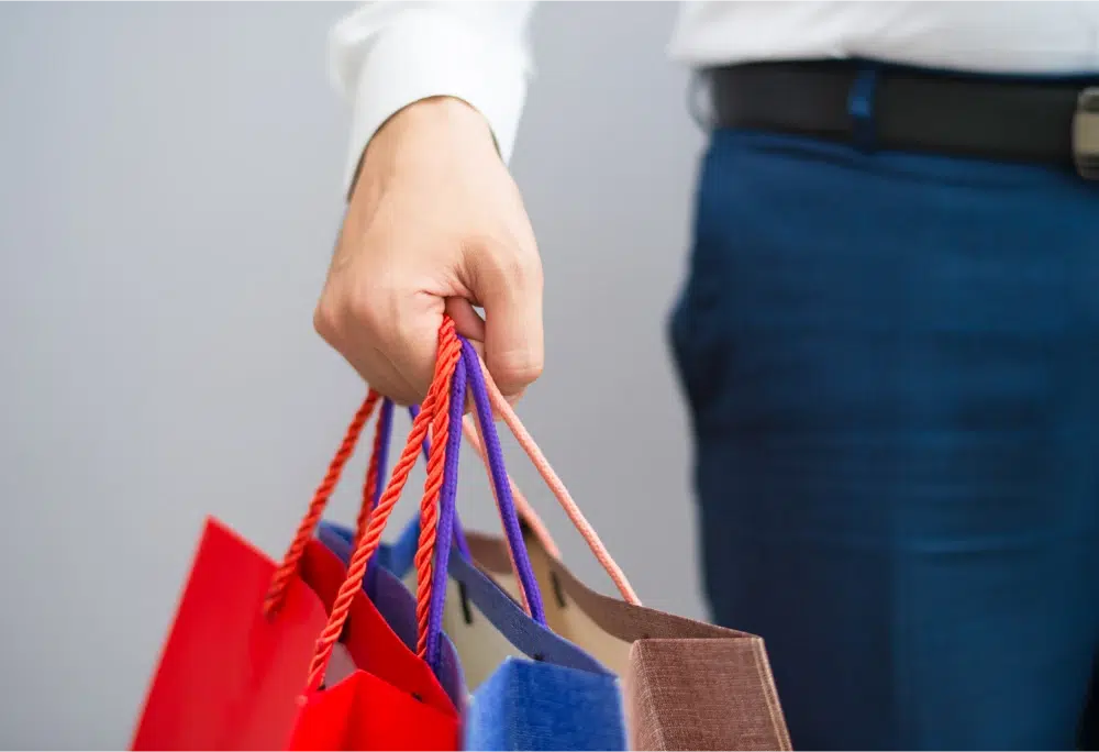 Person holding shopping bags